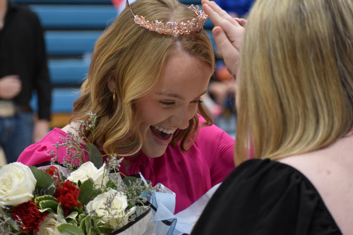 Gracie Demrow was all smiles while being crowned 2025 Basketball Sweetheart by last year's recipient, Madison Gibson.