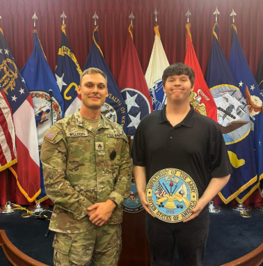 Noah Turpin (right) poses for a photo with Kentucky National Guard recruiter Chase Williams
